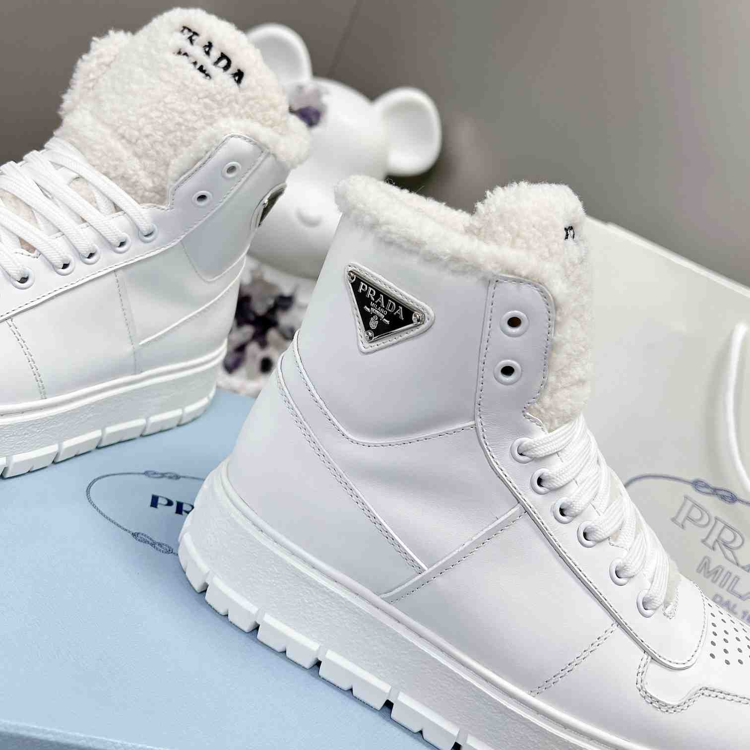 Prada Leather And Shearling High-top Sneakers - 
