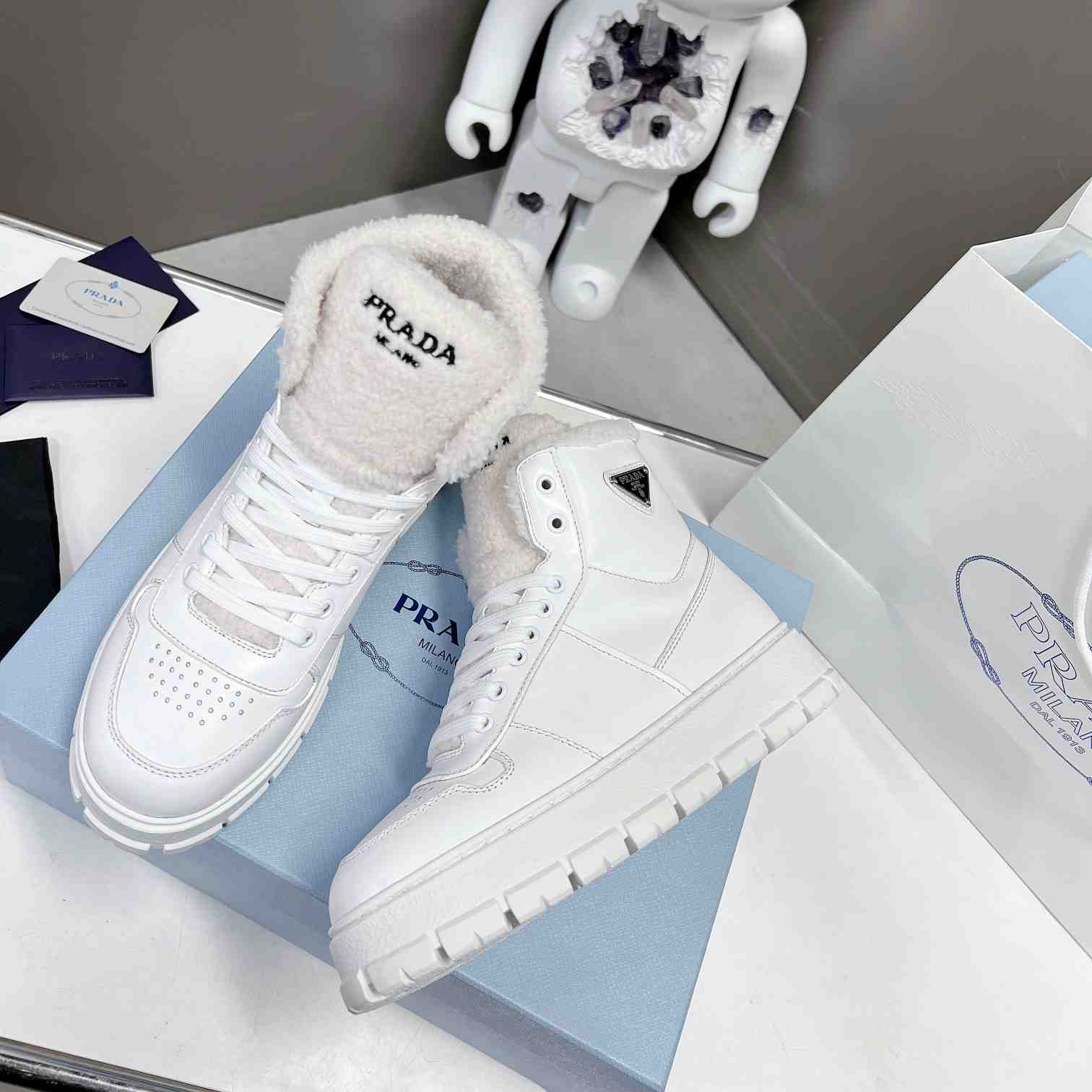 Prada Leather And Shearling High-top Sneakers - 