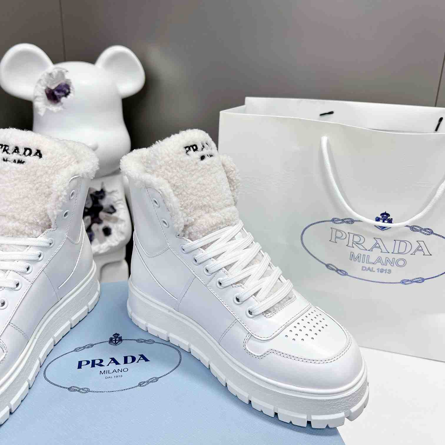 Prada Leather And Shearling High-top Sneakers - 