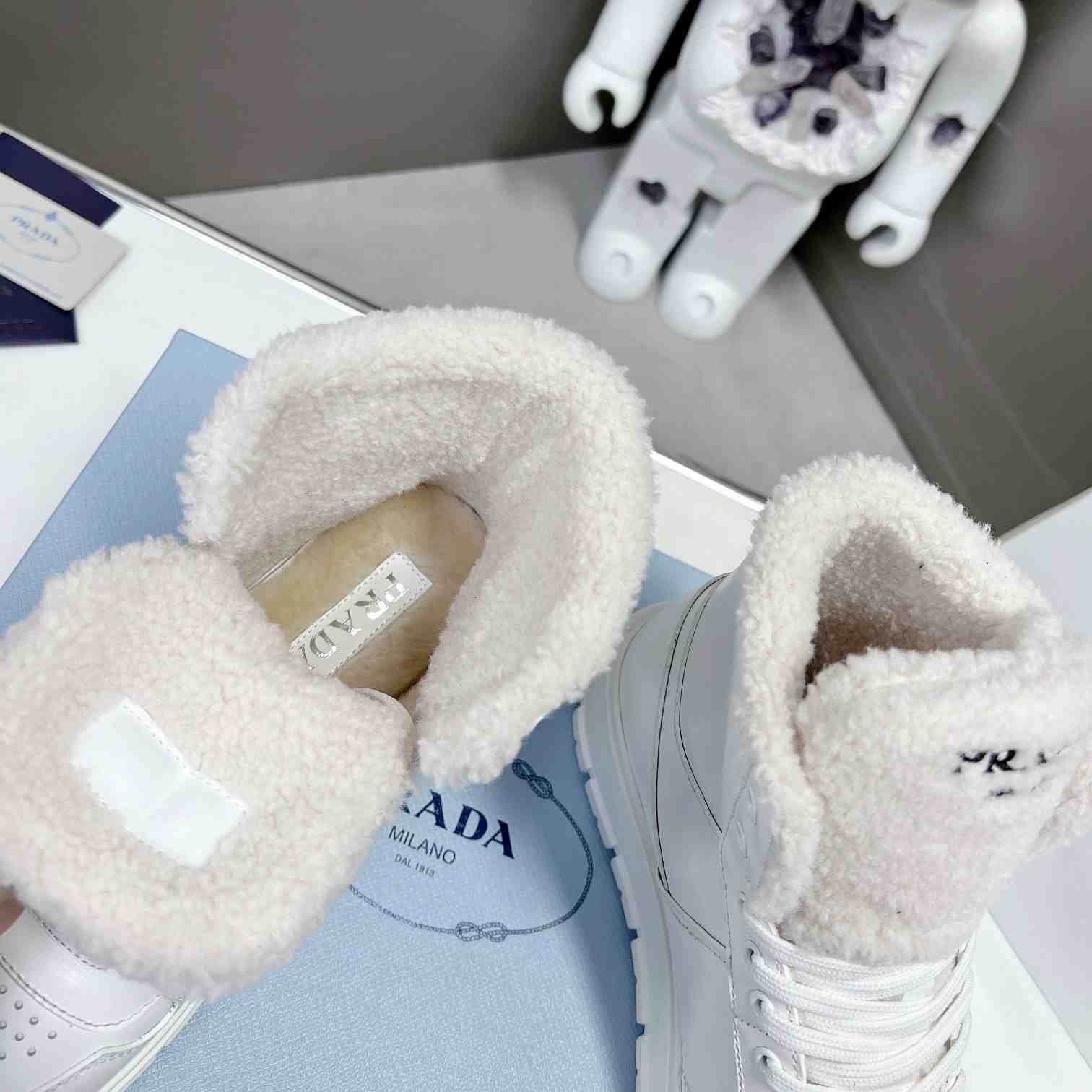Prada Leather And Shearling High-top Sneakers - 