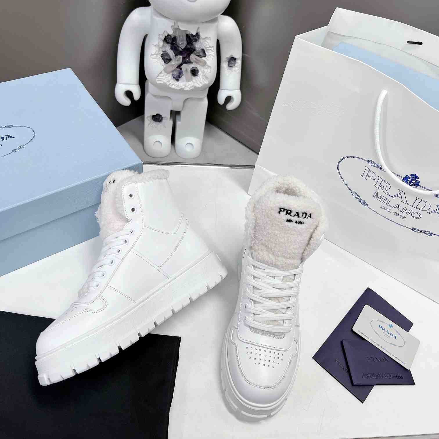 Prada Leather And Shearling High-top Sneakers - 