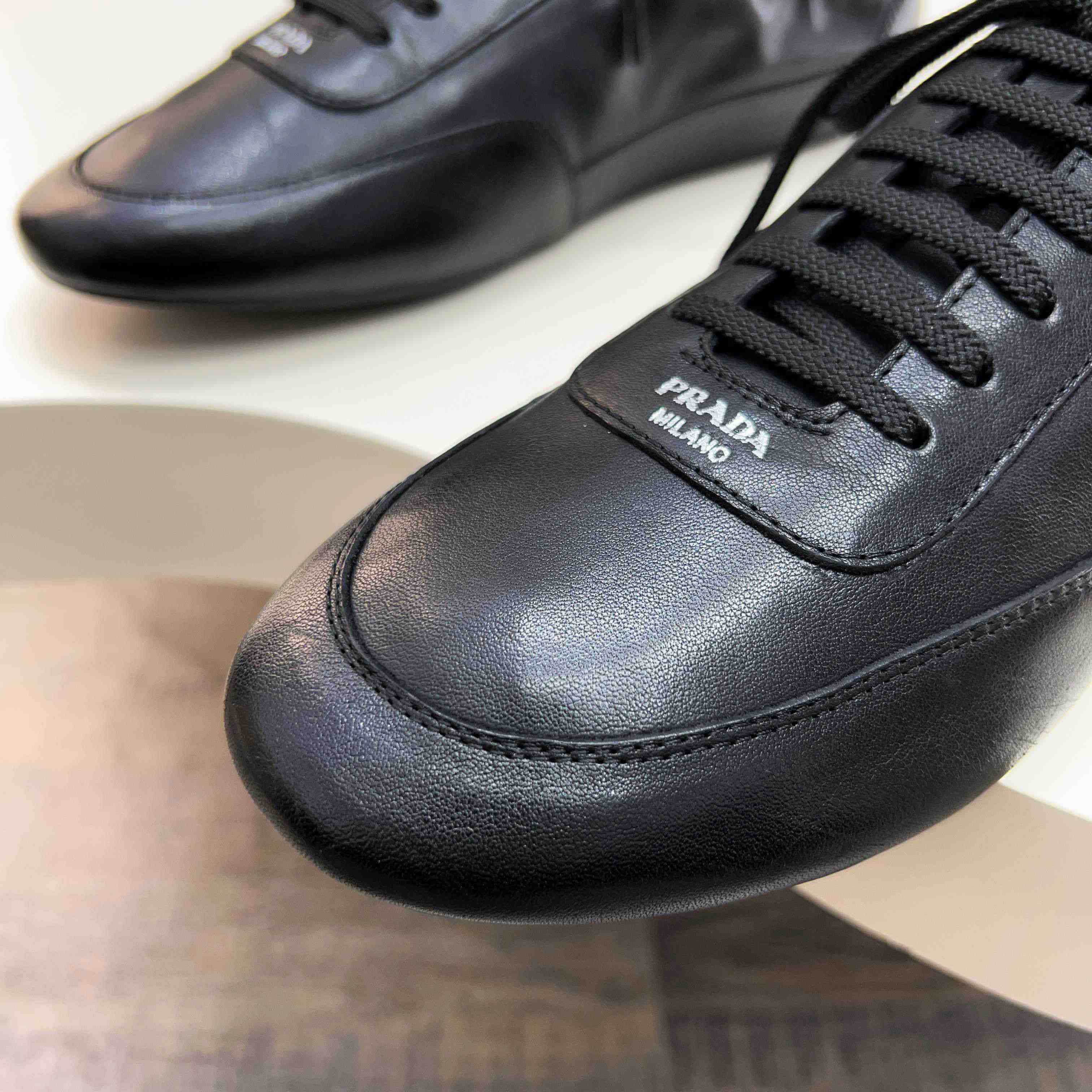 Prada Collapse Leather Sneakers - DesignerGu